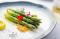 steamed asparagus with micro herb garnish
