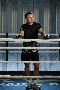 Owner of Deptford Boxing gym, leaning on the ropes of boxing ring smiling at his colleague being photographed for XERO Love Changes Everything campaign