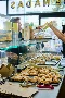 Customer being handed an empanada at De Nadas in Bethnal Green for Xero Love Changes Everything campaign