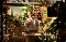 Florist tieing a bouquet for the XERO Love Changes Everything campaign photographed by Amy Murrell. Behind the Scenes image, showing film camera in front of the lens 