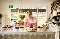 Hero campaign image of Founder of N5 Cafe in London placing a strawberry on a cake for Xero Love Changes Everything campaign by Amy Murrell