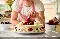 close up of the Founder of  N5 Cafe in London placing a strawberry on a cake for Xero Love Changes Everything campaign
